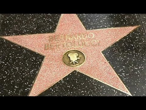 Film director Bernardo Bertolucci visits Hollywood walk of fame star five years late