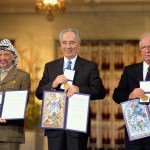 Yassar Arafat, Shimon Peres and Yitzhak Rabin with their Peace Prize Medals