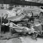 Damaged Car Being Inspected by Police