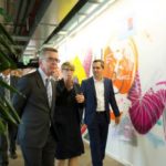 (L-R) German Interior Minister Thomas de Maiziere, Eva- Maria Kirschsieper, Facebook head of public policy D-A-CH and Martin Ott, Facebook managing director central Europe, walk during a visted at the Facebook office in Berlin, Germany